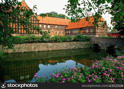 Pond in front of a building, Funen County, Denmark