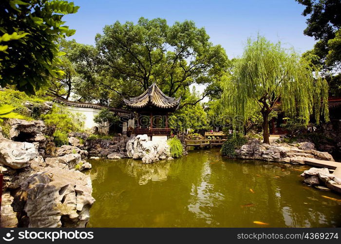 Pond in front of a gazebo, Yu Yuan Gardens, Shanghai, China
