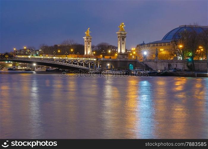 Pont Alexandre III or Alexander III bridge at night illumination in Paris, France