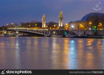 Pont Alexandre III or Alexander III bridge at night illumination in Paris, France