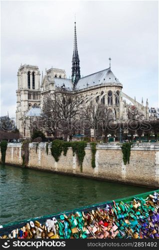 Pont de l&rsquo;Archeveche with love padlocks and cathedral Notre-Dame de Paris