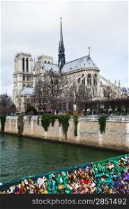 Pont de l&rsquo;Archeveche with love padlocks and cathedral Notre-Dame de Paris