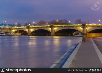 Pont de la Concorde at night illumination in Paris, France