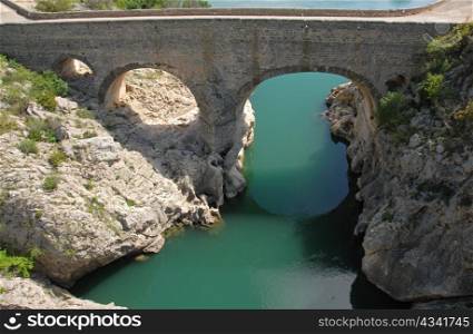 ""Pont du Diable", near St Guilhem du Desert, Herault, Languedoc Roussillon, old bridge on the herault river"