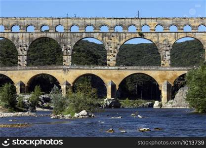 Pont du Gard. France. 06.16.12. Ancient Roman aqueduct built in the first century AD. It crosses the Gardon River near the town of Vers-Pont-du-Gard in southern France. UNESCO World Heritage Site.