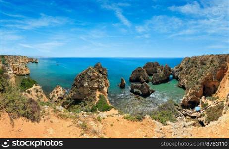 Ponta da Piedade  group of rock formations along coastline of Lagos town, Algarve, Portugal . People are unrecognizable. 