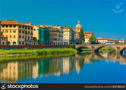 Ponte alla Carraia and Quay of the river Arno in Florence, San Frediano in Cestello on the background, Tuscany, Italy
