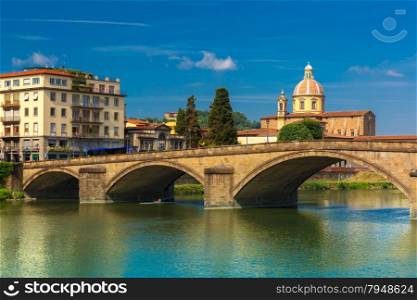 Ponte alla Carraia and Quay of the river Arno in Florence, San Frediano in Cestello on the background, Tuscany, Italy