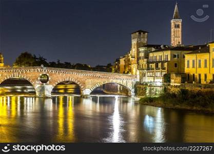 Ponte di Pietra. Bridge in Verona in a summer night, Italy,