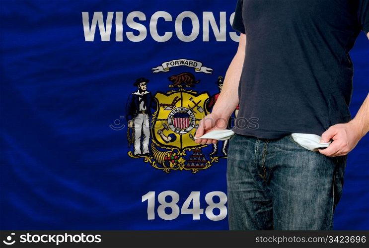 poor man showing empty pockets in front of american state of wisconsin flag