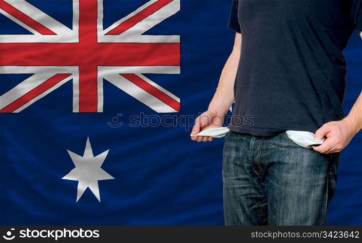 poor man showing empty pockets in front of australia flag