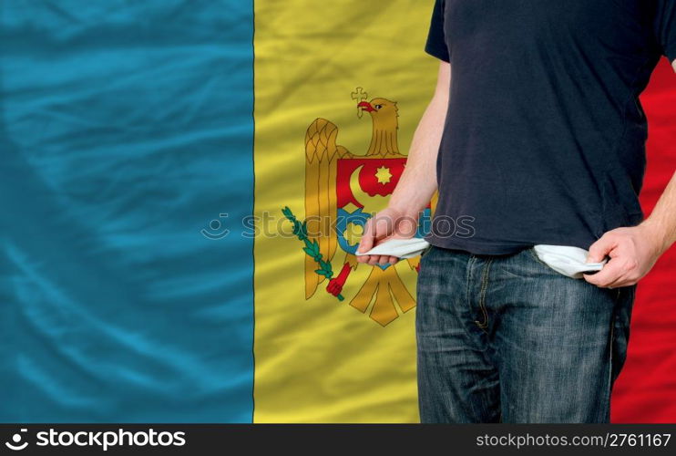 poor man showing empty pockets in front of moldova flag