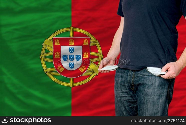 poor man showing empty pockets in front of portugal flag