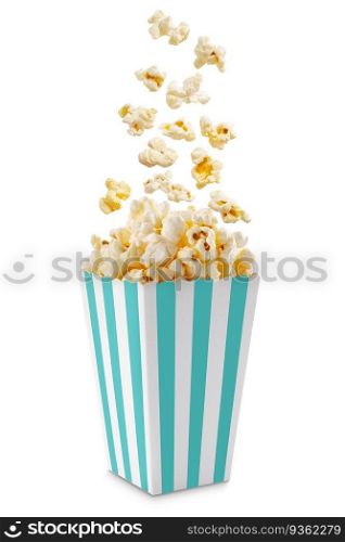 Popcorn flying out of turquoise white striped paper box isolated on white background with copy space. Splash, levitation of popcorn grains. 