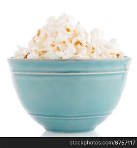 Popcorn in a blue bowl on a white background