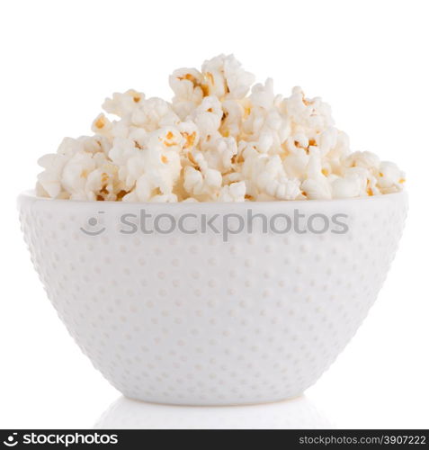 Popcorn in a white bowl on a white background