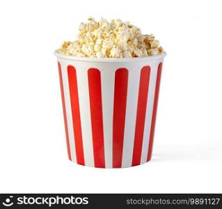 Popcorn in red and white striped cardboard bucket isolated on white background with clipping path