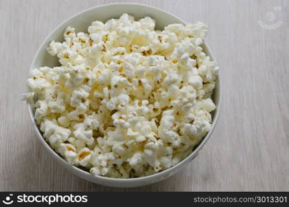 Popcorn in the bowl. Top view.