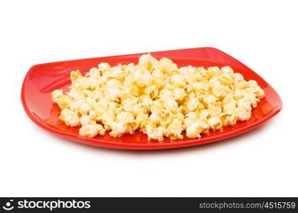 Popcorn on red plate isolated on white