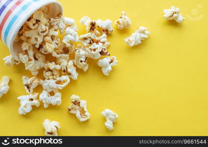 Popcorn paper bucket on yellow background