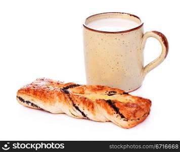 poppy pie and mug of milk isolated on white