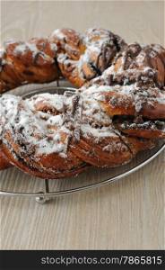 Poppy seed roll, garnished with chocolate and powdered sugar