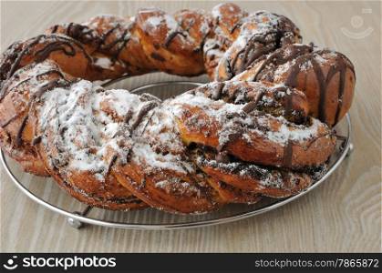 Poppy seed roll, garnished with chocolate and powdered sugar