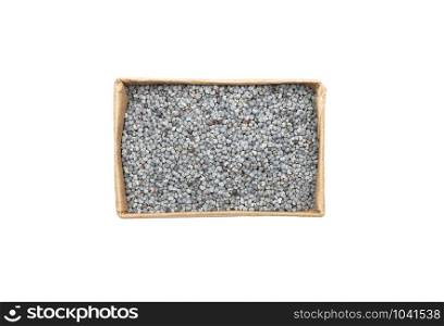 Poppy seeds in carton on white background