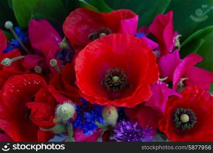Poppy, sweet pea and corn flowers bouquet close up