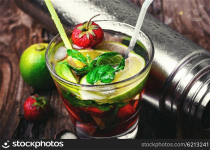 Popular alcoholic cocktail with lime,mint and strawberries