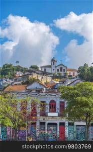 Popular bohemian area of   Santa Teresa in Rio de Janeiro. Historic buildings are painted with graffiti.
