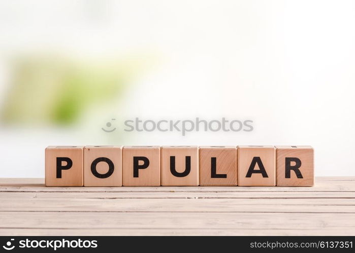 Popular sign made of cubes on a table with planks