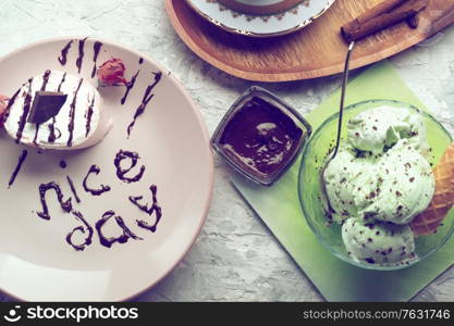 porcelain cup of coffee with pistachio ice cream served at table. life style concept