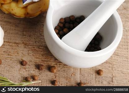 porcelain mortar and pestle with pepper