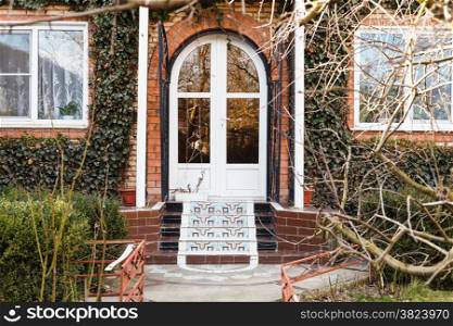 porch and door of country house in early spring day