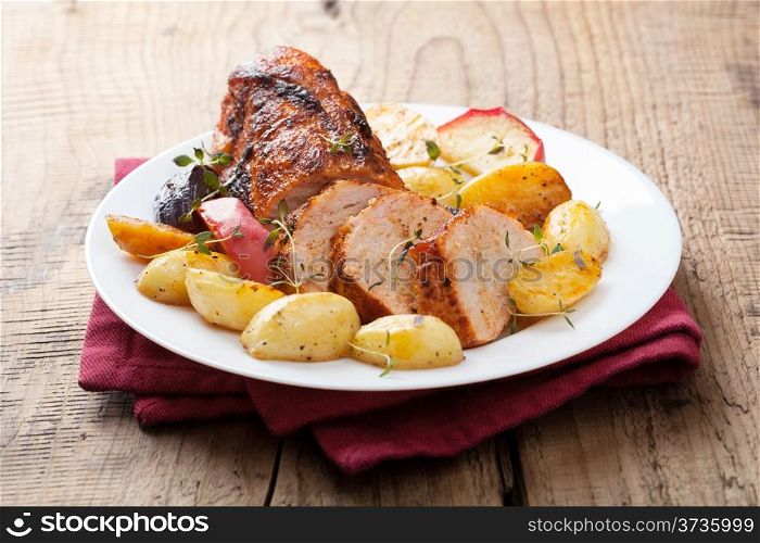 pork baked with vegetables on a tray