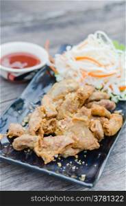 pork chitterlings fried . pork chitterlings fried served with chili sauce