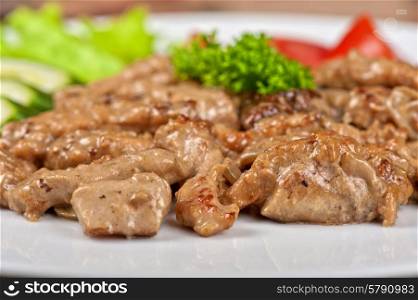 Pork chop. Pork chop with vegetable at plate