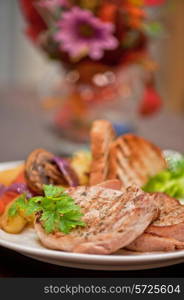 Pork chop with vegetable at plate