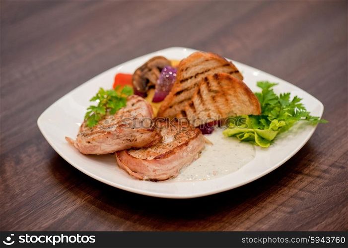 Pork chop with vegetable . Pork chop with vegetable at plate