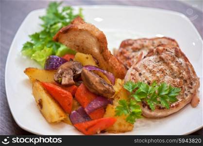 Pork chop with vegetable . Pork chop with vegetable at plate