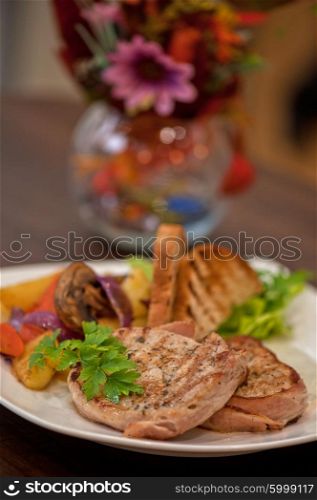Pork chop with vegetable. Pork chop with vegetable at plate