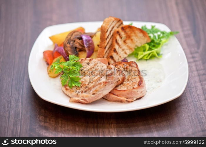 Pork chop with vegetable. Pork chop with vegetable at plate