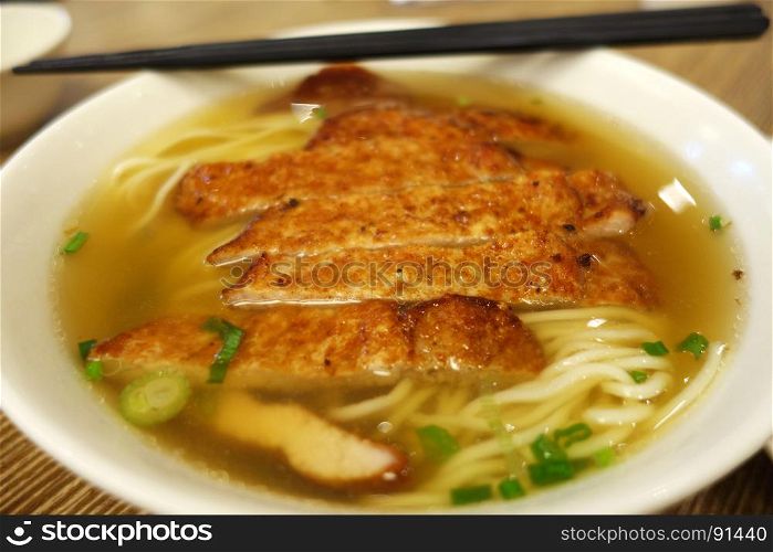 Pork chops with noodle soup. Chinese food.