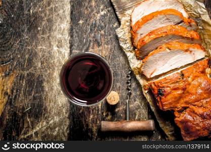 Pork grill with red wine. On wooden background.. Pork grill with red wine.
