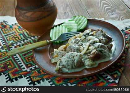 pork kidneys in cream sauce with mushrooms. Transcarpathian cuisine