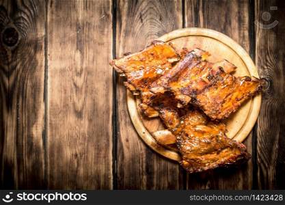 Pork ribs barbecue. On a wooden table.. Pork ribs barbecue.