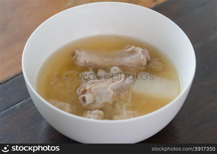 Pork ribs clear soup . Pork ribs clear soup with vegetable in white bowl