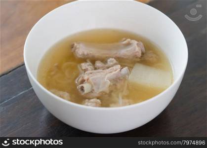 Pork ribs clear soup . Pork ribs clear soup with vegetable in white bowl