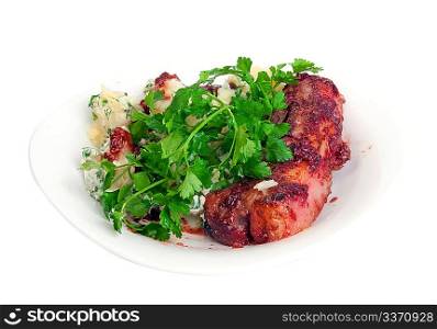 Pork ribs in cranberry sauce with potato and parsley on white dish